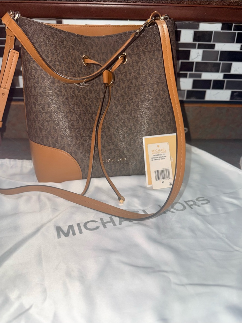 Has flaws needs fixed !Michael Kors Brown Logo Drawstring Bucket Bag size large‎